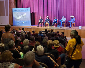 The attending crowd listens to an anaswer for Louanne Stephens in the BHS Auditorium